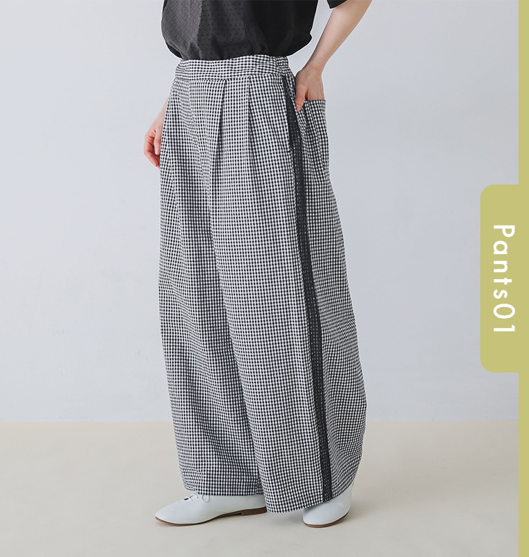 cloudnineのットンリネン サイドレースセミフレアパンツをモデルが着用したパンツ寄りカット