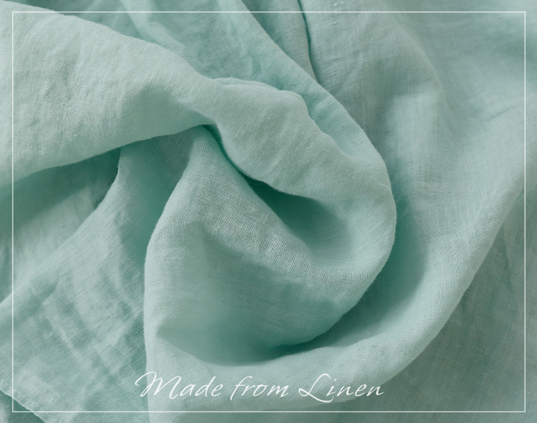 Brocante リネンキャンバスグランシャツのミントグリーンの生地を寄せて、リネン100％のやわらかな風合いを見せた素材アップ