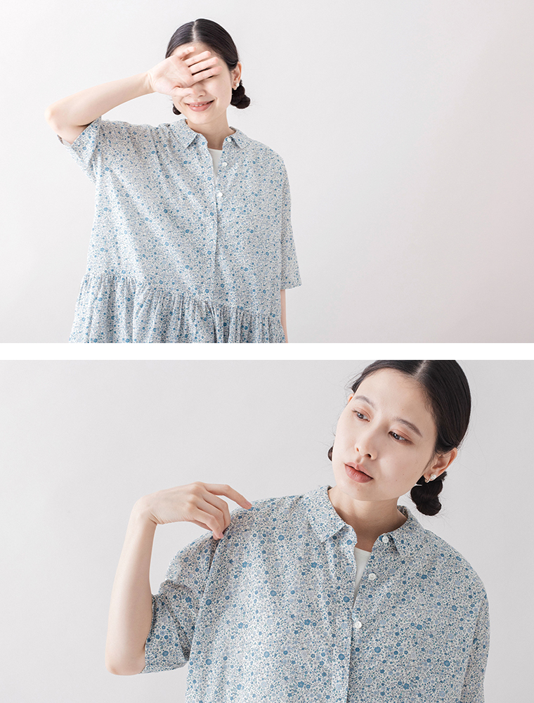 HEAVENLY フラワープリントワンピースのオフホワイトを着た女性モデルの上半身とボタンディテール