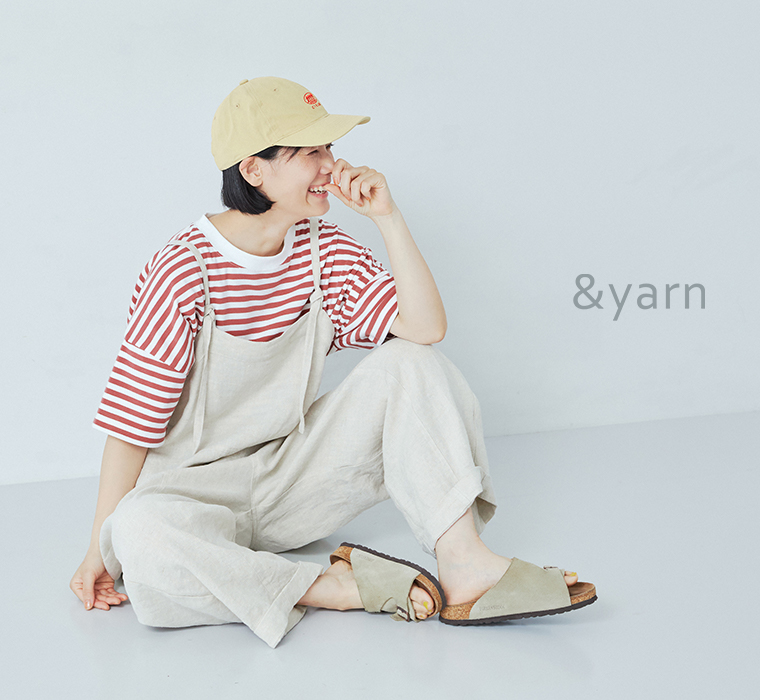 &yarn 1枚で着映えるワイドプルオーバー半袖(ピンク)を着用し座ったカット