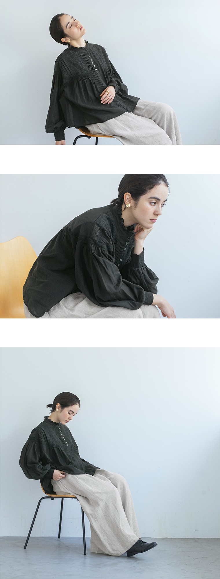 ピンタックレースブラウス（ブラック）とワイドパンツを着用した女性モデルの座りスタイル